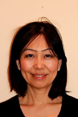 headshot of Kuniko Ashizawa with tan background