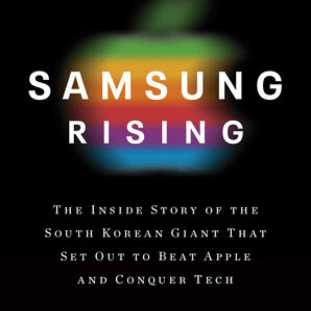 Text: Samsung Rising over a blurred out rainbow colored Apple logo